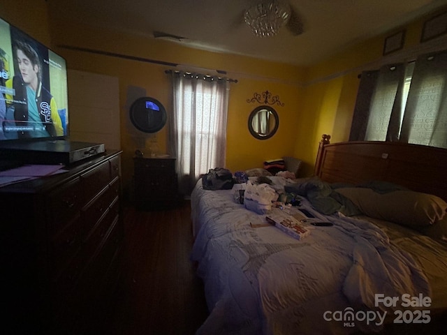bedroom with wood finished floors
