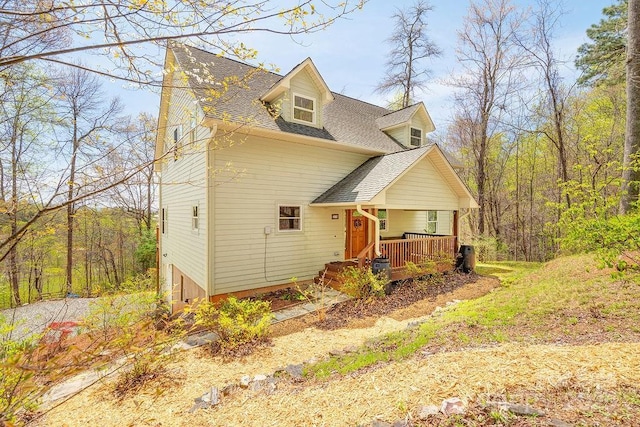 view of front of house featuring a porch and a shingled roof