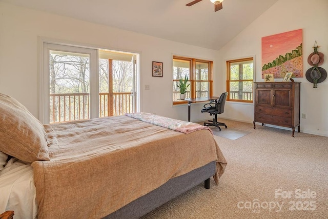 carpeted bedroom featuring lofted ceiling and baseboards