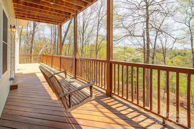 deck featuring a wooded view