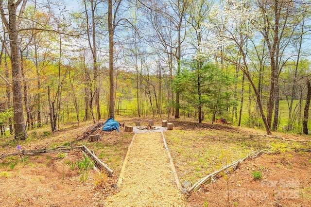 view of yard with a forest view