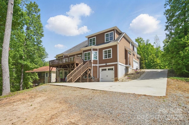 2501 Mt Isle Harbor Dr, Charlotte, NC 28214 - view of front of house featuring concrete driveway, a wooden deck, stairs, and a garage