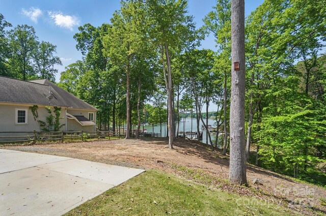 2501 Mt Isle Harbor Dr, Charlotte, NC 28214 - view of yard featuring a water view and fence
