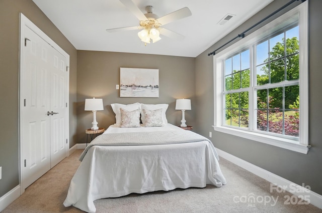 2501 Mt Isle Harbor Dr, Charlotte, NC 28214 - bedroom featuring ceiling fan, baseboards, carpet floors, and visible vents