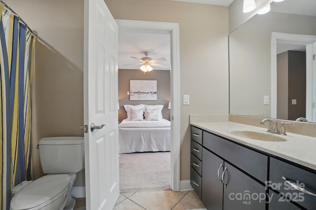 2501 Mt Isle Harbor Dr, Charlotte, NC 28214 - full bathroom with tile patterned floors, a ceiling fan, vanity, toilet, and ensuite bath