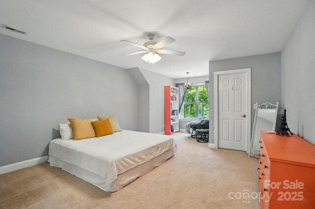 2501 Mt Isle Harbor Dr, Charlotte, NC 28214 - bedroom with visible vents, a ceiling fan, baseboards, and light carpet