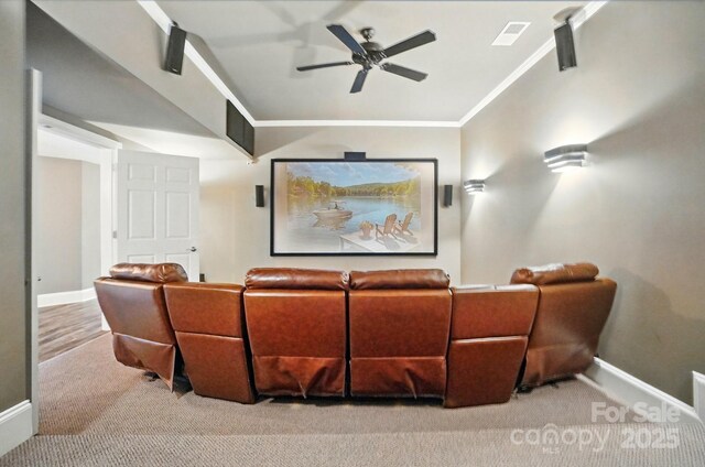 2501 Mt Isle Harbor Dr, Charlotte, NC 28214 - carpeted home theater with ornamental molding, baseboards, a ceiling fan, and visible vents