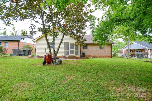 1222 Glenarden Dr, Rock Hill, SC 29730 - back of house with a fenced backyard, a yard, and entry steps