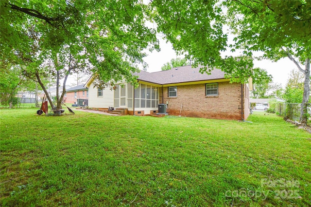 1222 Glenarden Dr, Rock Hill, SC 29730 - back of house featuring a fenced backyard, a sunroom, central AC unit, crawl space, and a yard