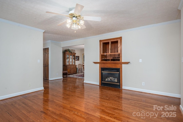 1 Horace Grigg Cir, Shelby, NC 28152 - unfurnished living room with baseboards, ceiling fan, a textured ceiling, wood finished floors, and a glass covered fireplace
