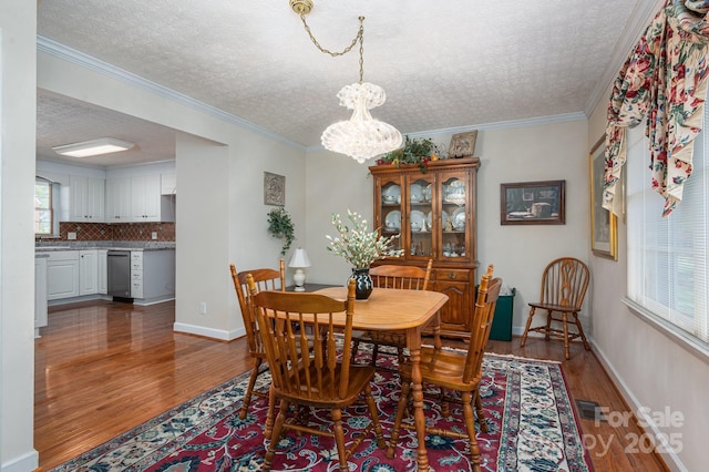 1 Horace Grigg Cir, Shelby, NC 28152 - dining area with visible vents, baseboards, an inviting chandelier, a textured ceiling, and wood finished floors