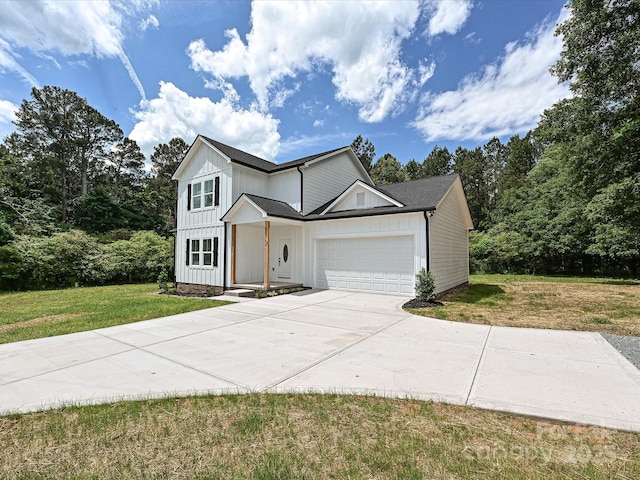 traditional-style house featuring an attached garage, a shingled roof, board and batten siding, a front lawn, and concrete driveway