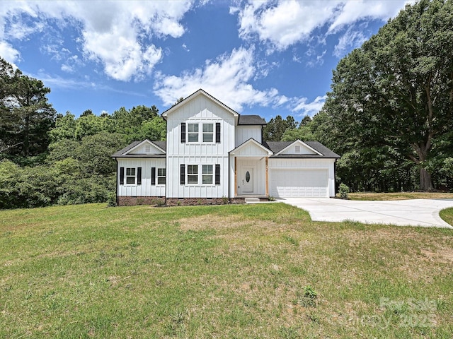 view of front of house with concrete driveway, board and batten siding, an attached garage, and a front lawn
