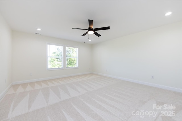 spare room with light carpet, baseboards, a ceiling fan, and recessed lighting