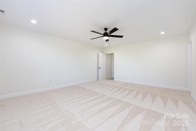 spare room with recessed lighting, baseboards, ceiling fan, visible vents, and light colored carpet