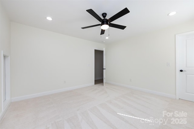 unfurnished room with a ceiling fan, baseboards, recessed lighting, and light colored carpet