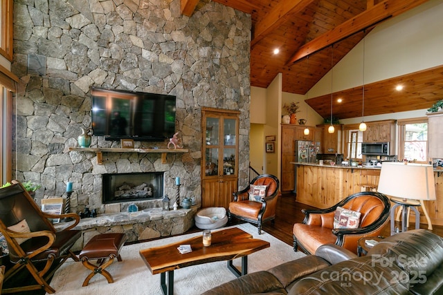 living room featuring a fireplace, wood ceiling, beamed ceiling, high vaulted ceiling, and hardwood / wood-style flooring