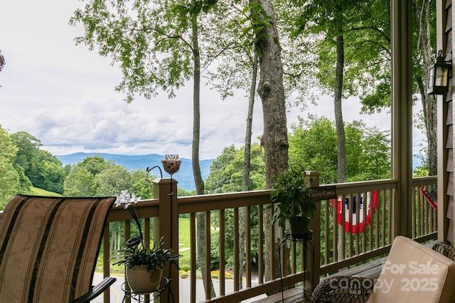 wooden deck featuring a water view