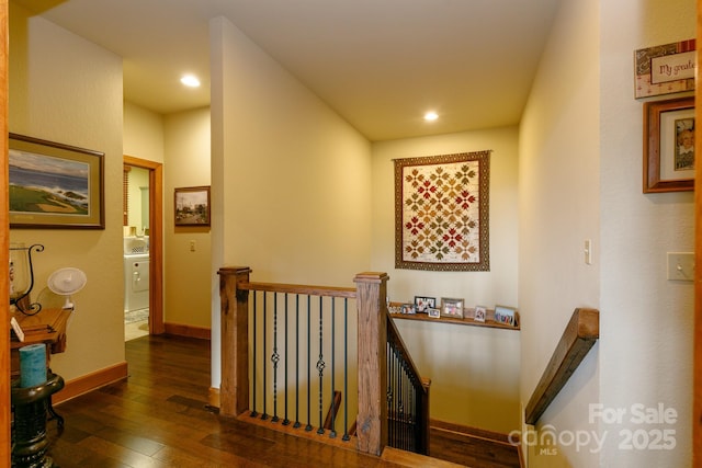 hallway with baseboards, dark wood-style flooring, an upstairs landing, and recessed lighting