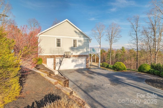 61 Buckle Rdg, Weaverville, NC 28787 - view of property exterior featuring asphalt driveway and an attached garage