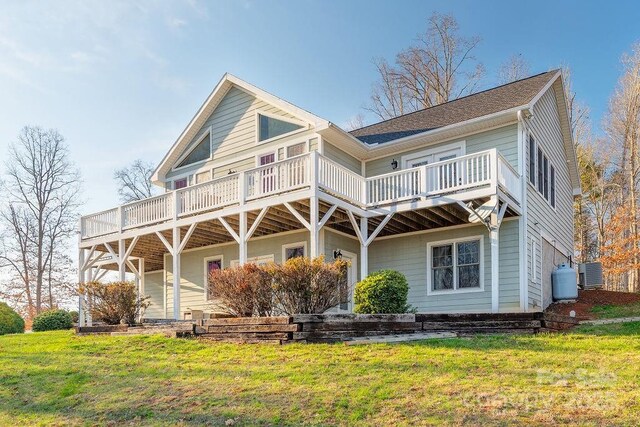 61 Buckle Rdg, Weaverville, NC 28787 - back of property featuring central AC, a lawn, and a deck