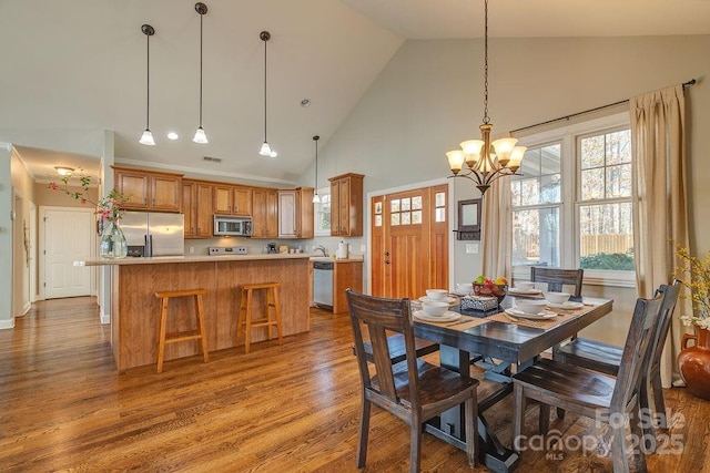 61 Buckle Rdg, Weaverville, NC 28787 - dining room featuring high vaulted ceiling, wood finished floors, and a chandelier