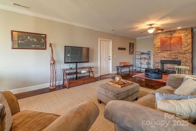 61 Buckle Rdg, Weaverville, NC 28787 - living area featuring baseboards, a ceiling fan, wood finished floors, crown molding, and a stone fireplace