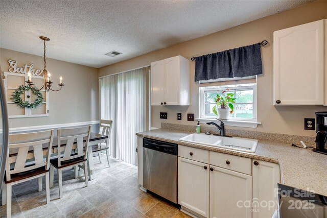 kitchen with a sink, a textured ceiling, dishwasher, a notable chandelier, and visible vents