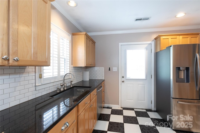 kitchen featuring stainless steel appliances, a sink, tile patterned floors, light brown cabinets, and crown molding