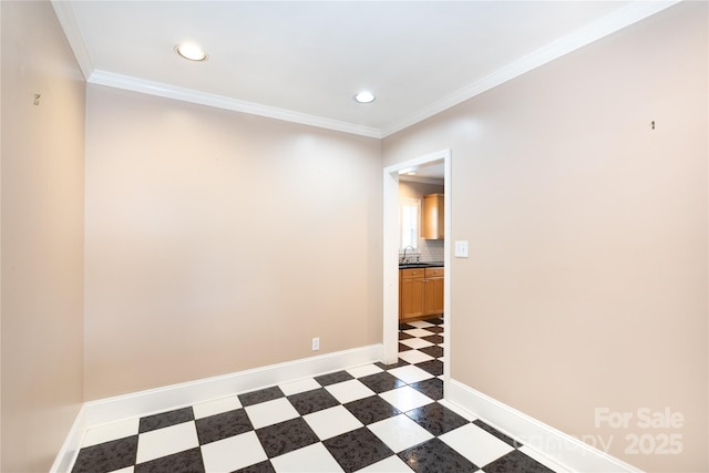 spare room with recessed lighting, a sink, crown molding, light floors, and baseboards