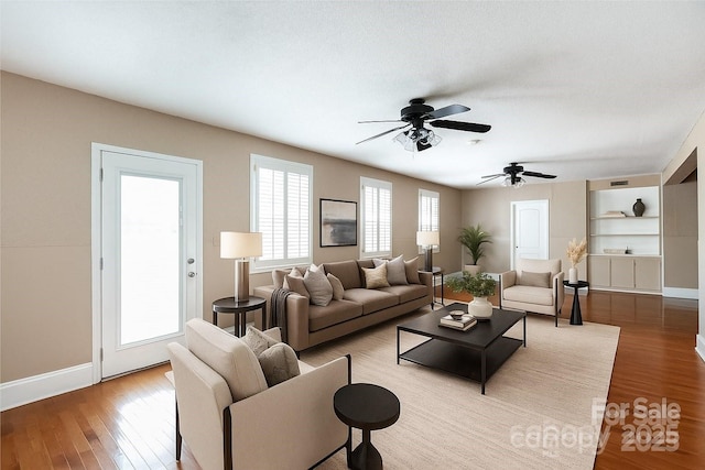 539 Marsh Rd, Charlotte, NC 28209 - living area with wood finished floors, a ceiling fan, and built in features
