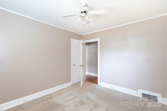 539 Marsh Rd, Charlotte, NC 28209 - empty room featuring ornamental molding, a ceiling fan, and light colored carpet