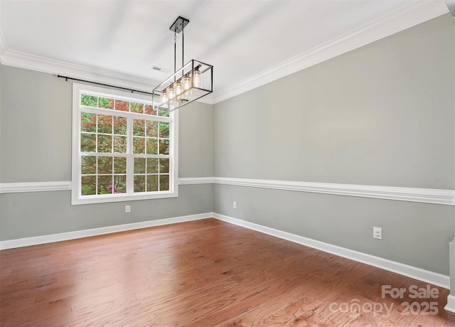 14220 Stewarts Bend Ln, Charlotte, NC 28277 - empty room featuring baseboards, a chandelier, ornamental molding, and wood finished floors