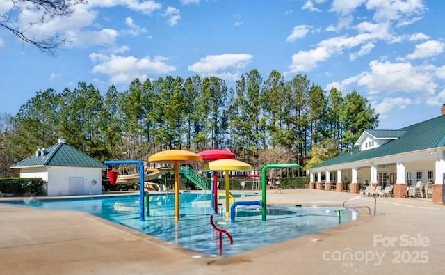 14220 Stewarts Bend Ln, Charlotte, NC 28277 - community pool featuring a water play area