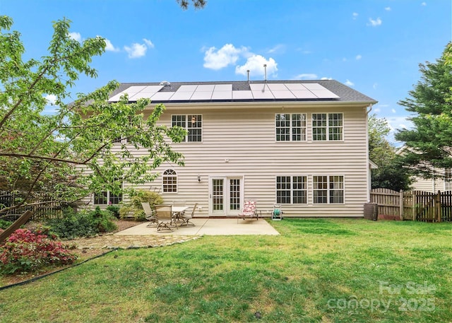 14220 Stewarts Bend Ln, Charlotte, NC 28277 - back of house featuring a yard, a patio, fence, and solar panels