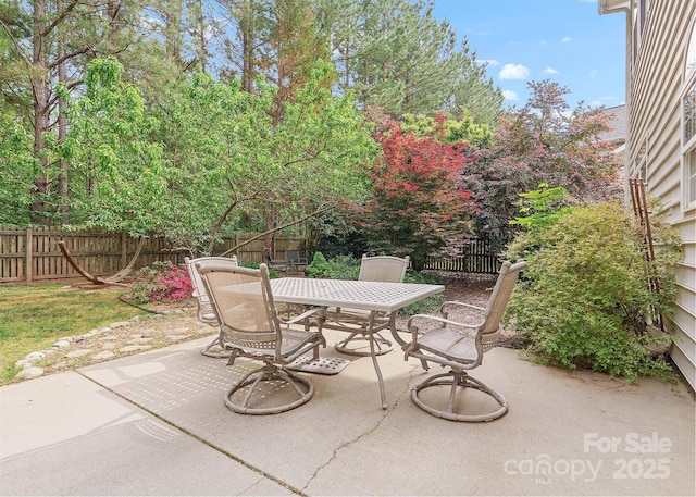 14220 Stewarts Bend Ln, Charlotte, NC 28277 - view of patio featuring a fenced backyard and outdoor dining space