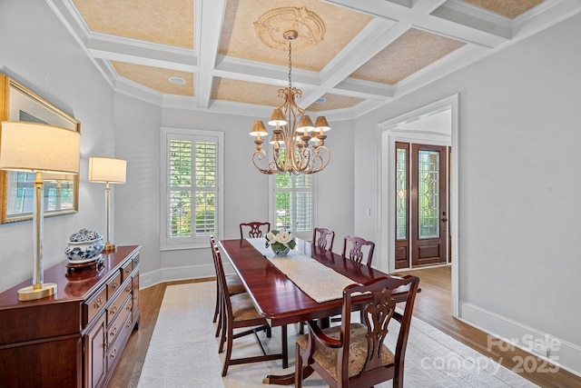 17040 Jetton Rd, Cornelius, NC 28031 - dining space with light wood-style floors, coffered ceiling, a chandelier, beam ceiling, and baseboards