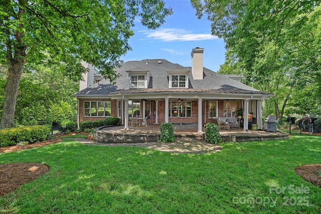 17040 Jetton Rd, Cornelius, NC 28031 - rear view of house with a chimney, brick siding, a ceiling fan, and a patio
