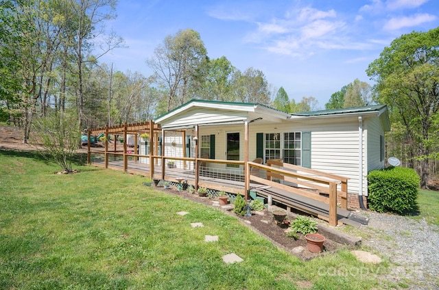 6282 Lor Rd, Morganton, NC 28655 - back of property with a wooden deck, a yard, and metal roof