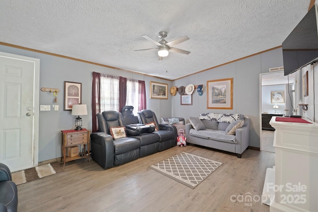 6282 Lor Rd, Morganton, NC 28655 - living room featuring a ceiling fan, lofted ceiling, crown molding, and light wood-type flooring