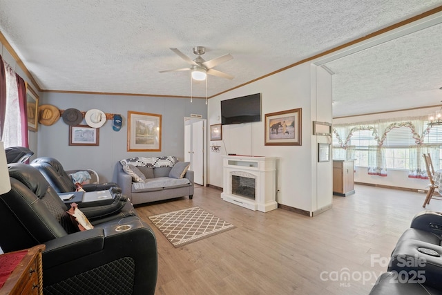 6282 Lor Rd, Morganton, NC 28655 - living room with a ceiling fan, wood finished floors, a textured ceiling, and crown molding