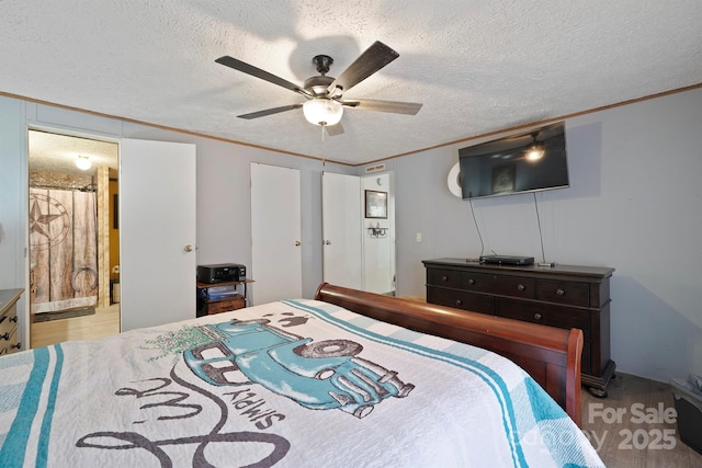 6282 Lor Rd, Morganton, NC 28655 - bedroom with ensuite bathroom, wood finished floors, a textured ceiling, and ornamental molding