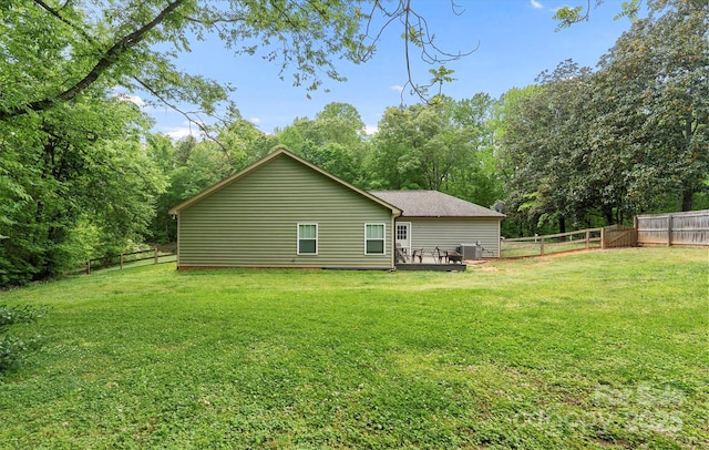 10340 Williams Rd, Mint Hill, NC 28227 - back of property featuring central AC, view of wooded area, and a wooden deck