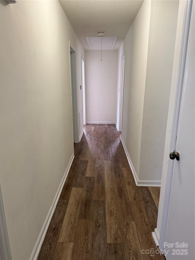 629 Belmorrow Dr, Charlotte, NC 28214 - hall featuring attic access, dark wood-style flooring, and baseboards