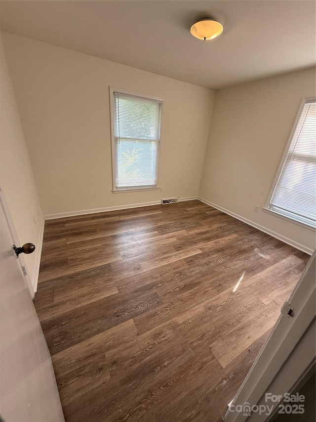 629 Belmorrow Dr, Charlotte, NC 28214 - empty room with wood finished floors and baseboards