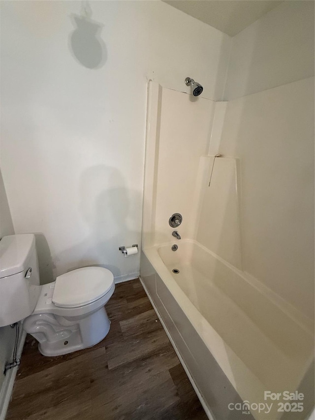 629 Belmorrow Dr, Charlotte, NC 28214 - bathroom featuring toilet, wood finished floors, and  shower combination