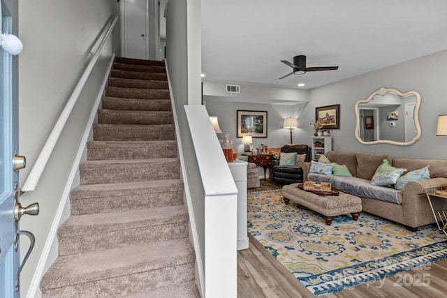 stairway featuring visible vents, recessed lighting, a ceiling fan, and wood finished floors