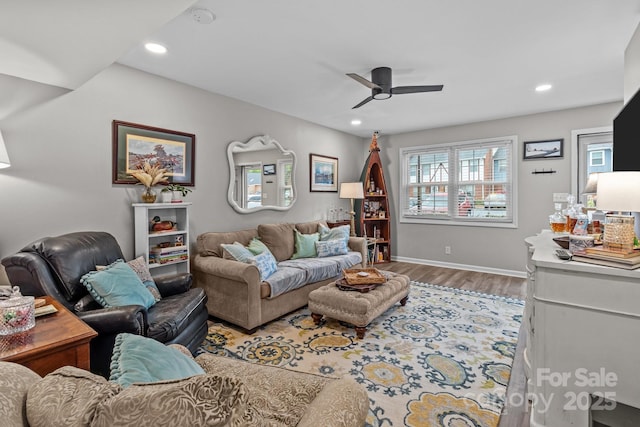 living area featuring wood finished floors, baseboards, a ceiling fan, and recessed lighting
