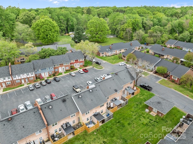 aerial view featuring a residential view and a forest view
