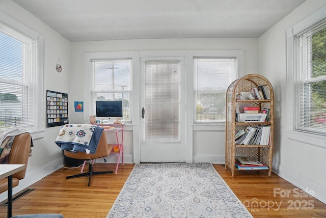 doorway to outside with light wood-style floors